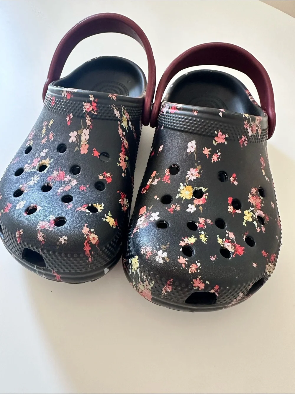 CROCS Kids Black Floral Clogs with Burgundy Heel Strap